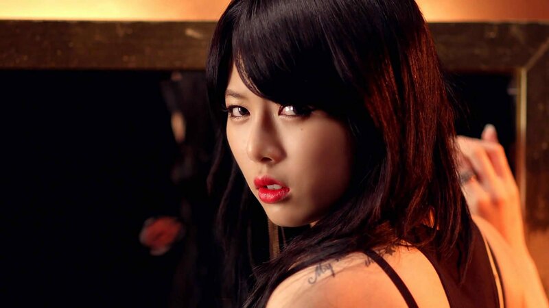 woman with red lipstick and tattoo