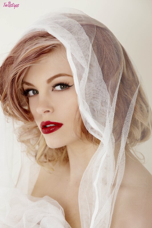 woman with red lipstick and veil
