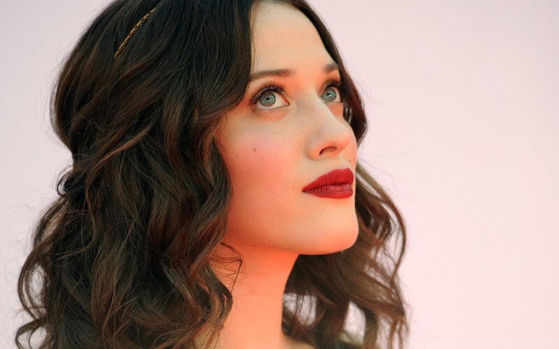 woman with red lipstick and wavy hair