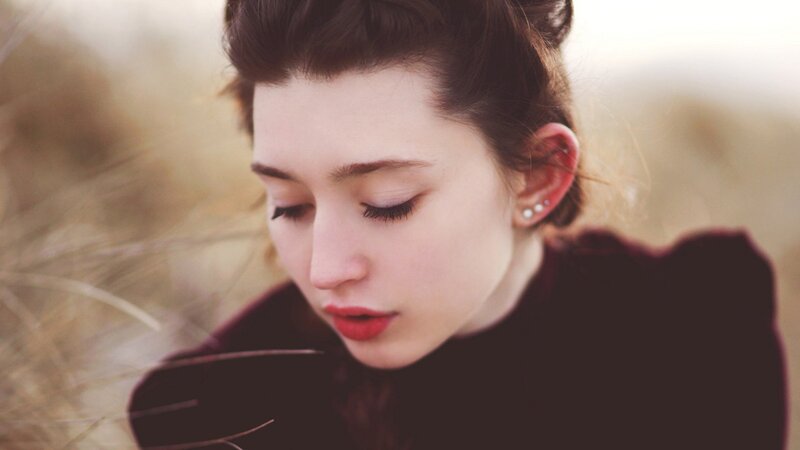 Woman with Red Lipstick — Brown, Contemplative, Sunset