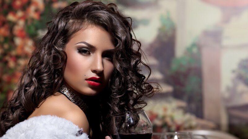 woman with red lipstick holding wine