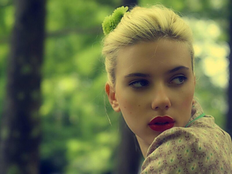 woman with red lipstick in forest