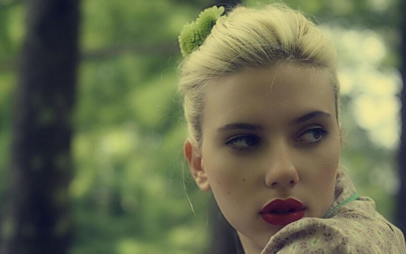 woman with red lipstick in forest