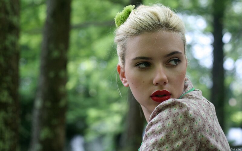 woman with red lipstick in forest