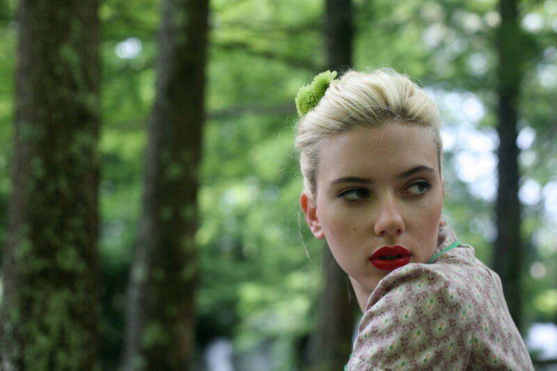 woman with red lipstick in forest