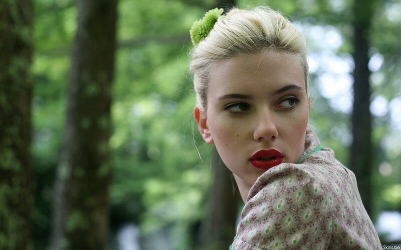 woman with red lipstick in forest