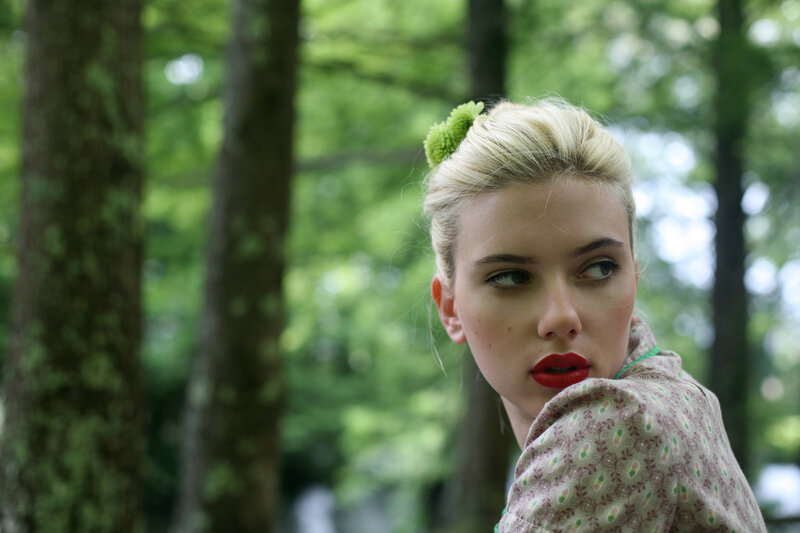 woman with red lipstick in forest
