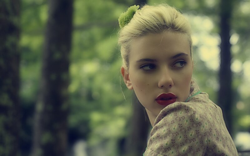 woman with red lipstick in forest