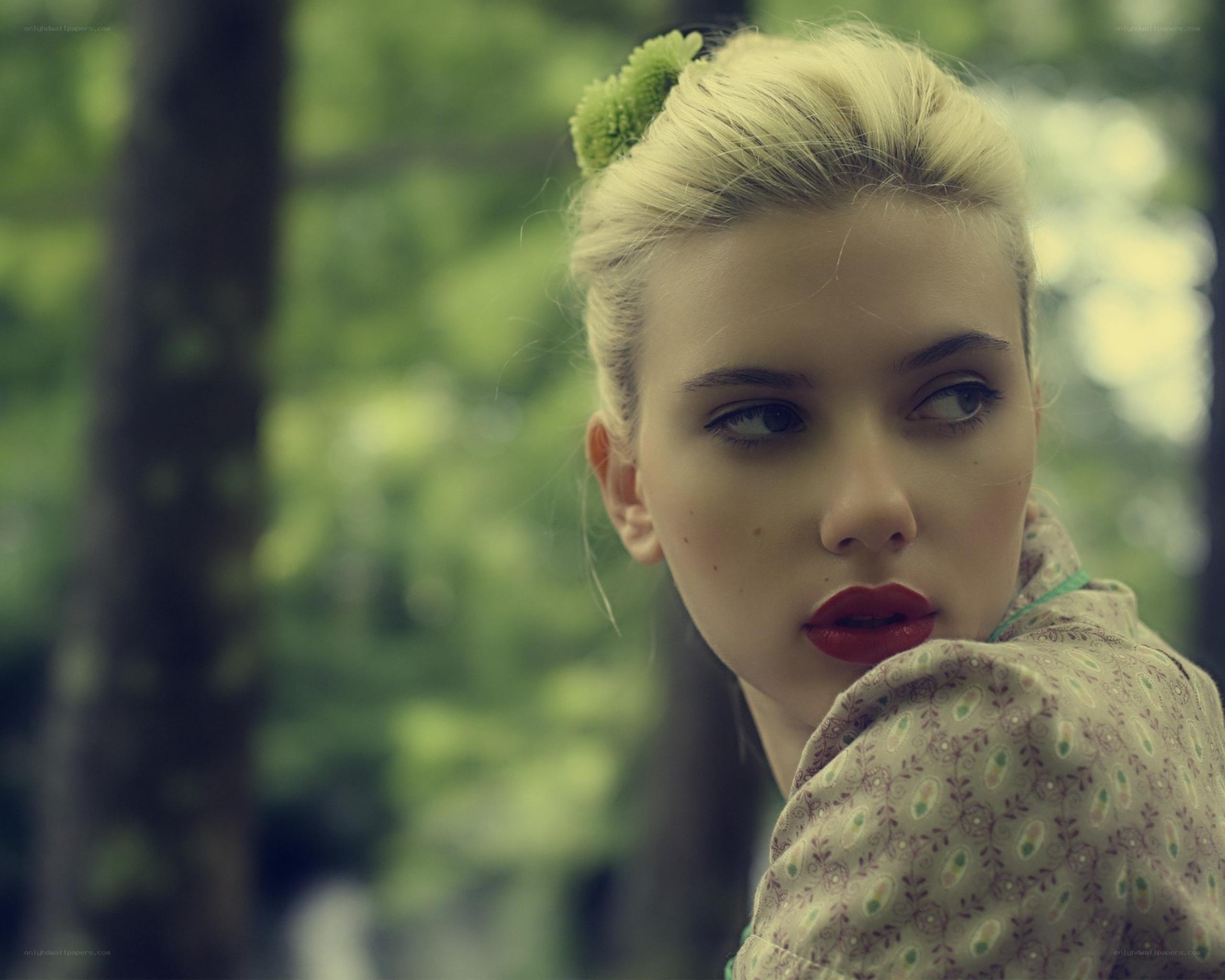 woman with red lipstick in forest