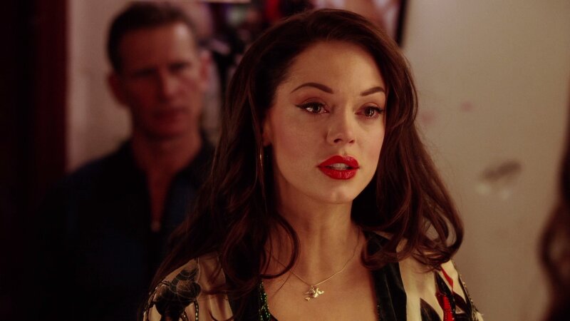 woman with red lipstick in room