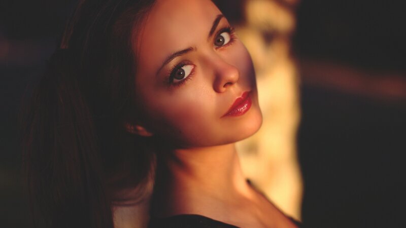 woman with red lipstick in warm light