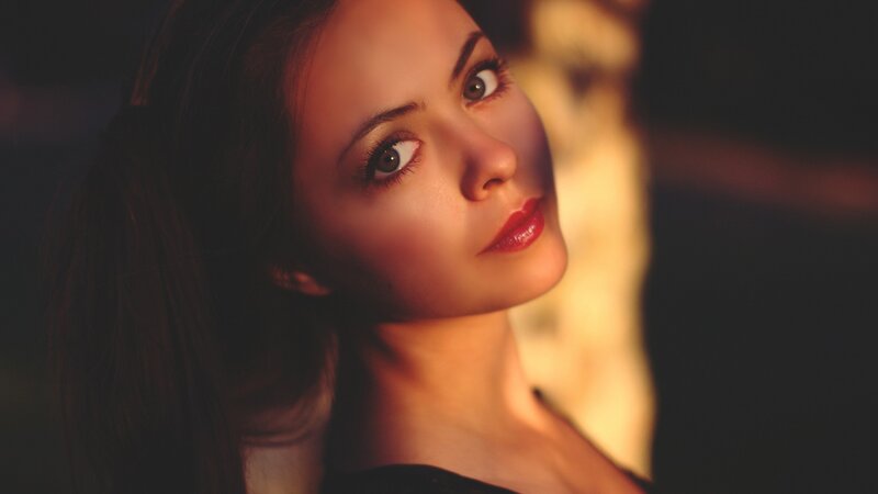woman with red lipstick in warm light