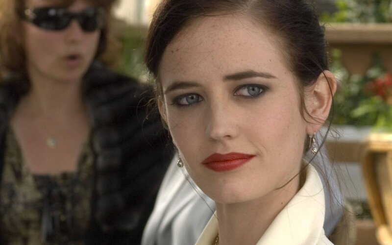 woman with red lipstick looking at camera