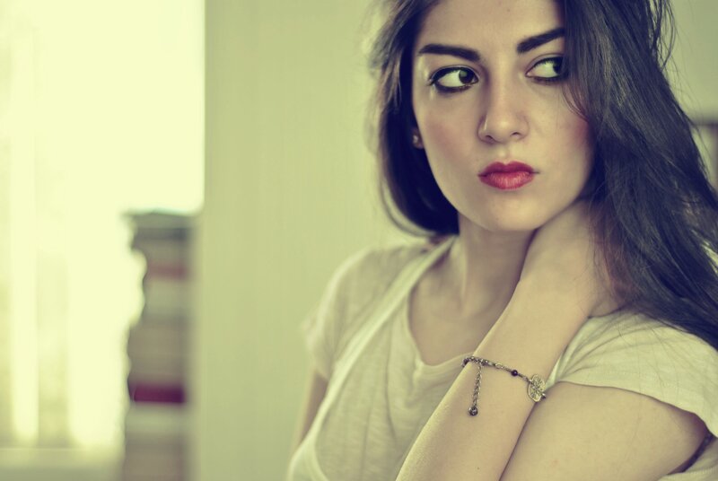 woman with red lipstick looking away