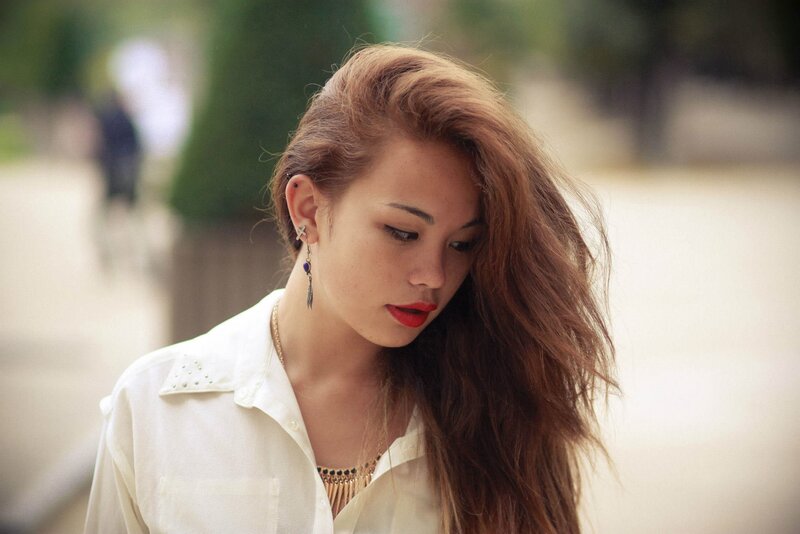 woman with red lipstick looking down