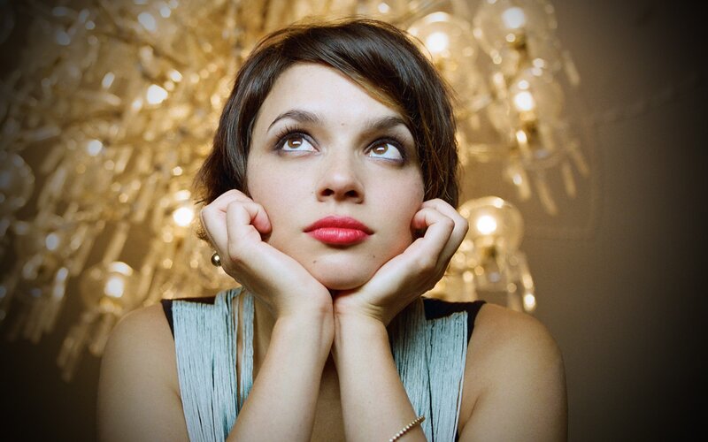woman with red lipstick looking up