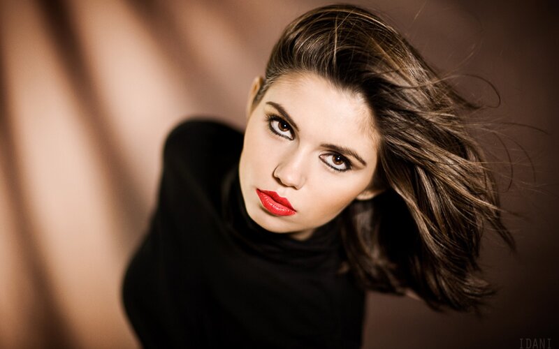 woman with red lipstick looking up