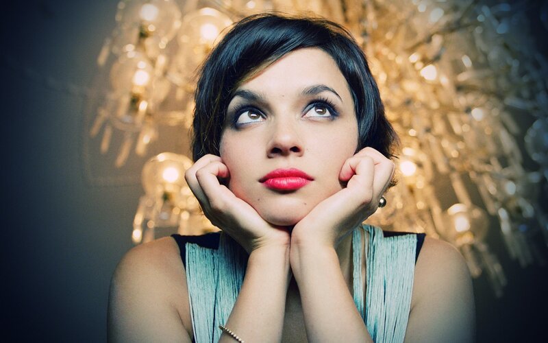 woman with red lipstick looking up