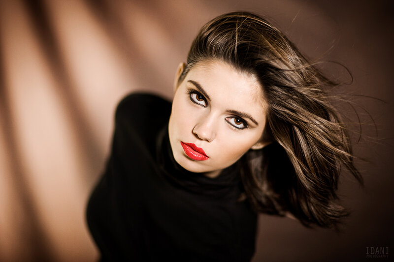 woman with red lipstick looking up
