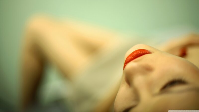 woman with red lipstick lying down