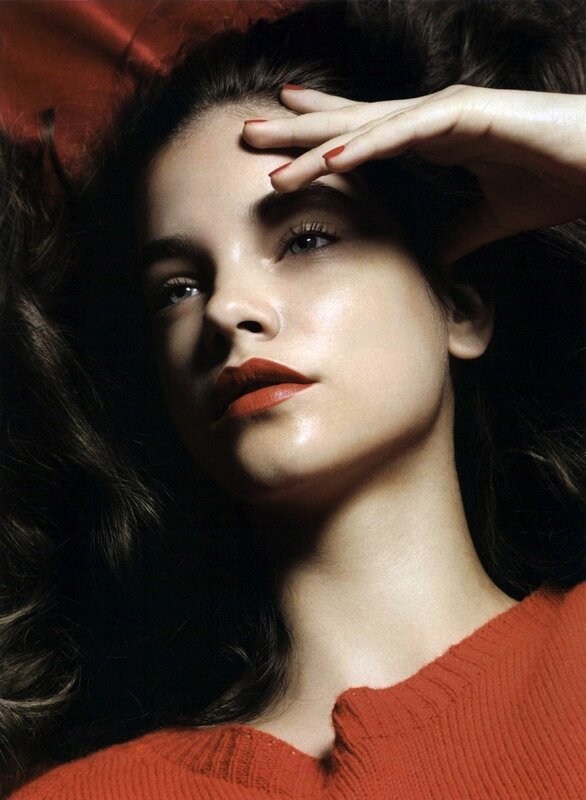 woman with red lipstick lying down