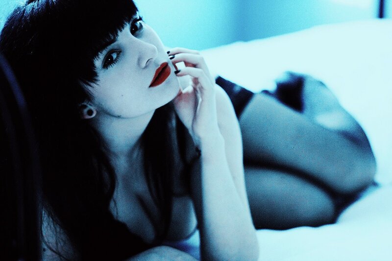 woman with red lipstick lying down