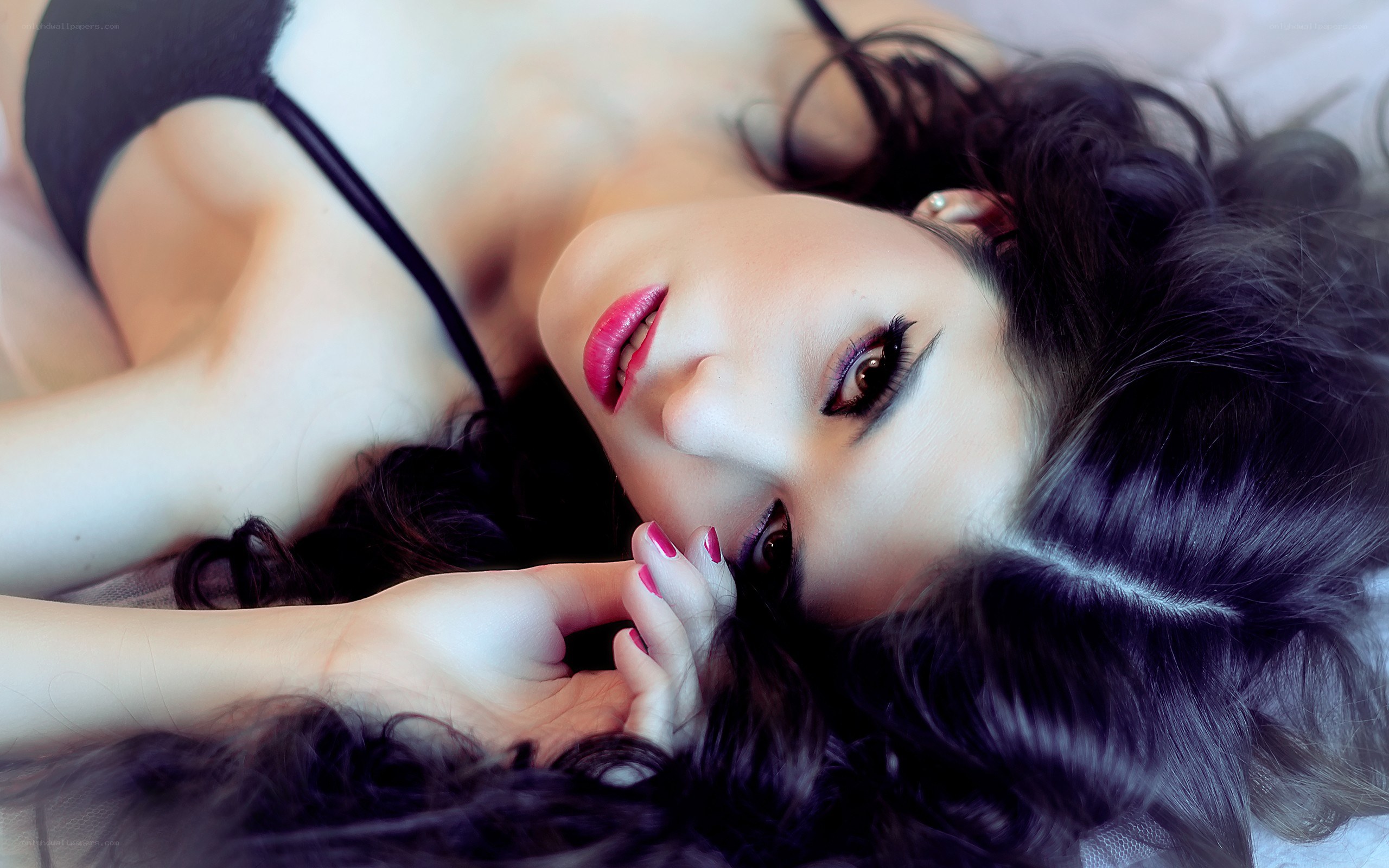 woman with red lipstick lying down