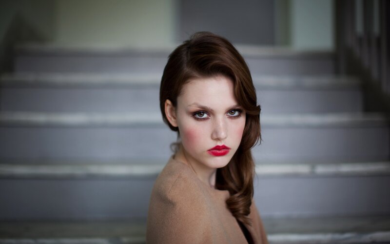 woman with red lipstick on stairs