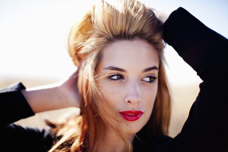 woman with red lipstick outdoors
