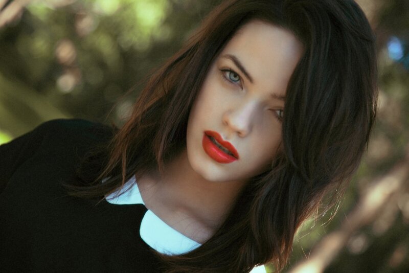 woman with red lipstick outdoors