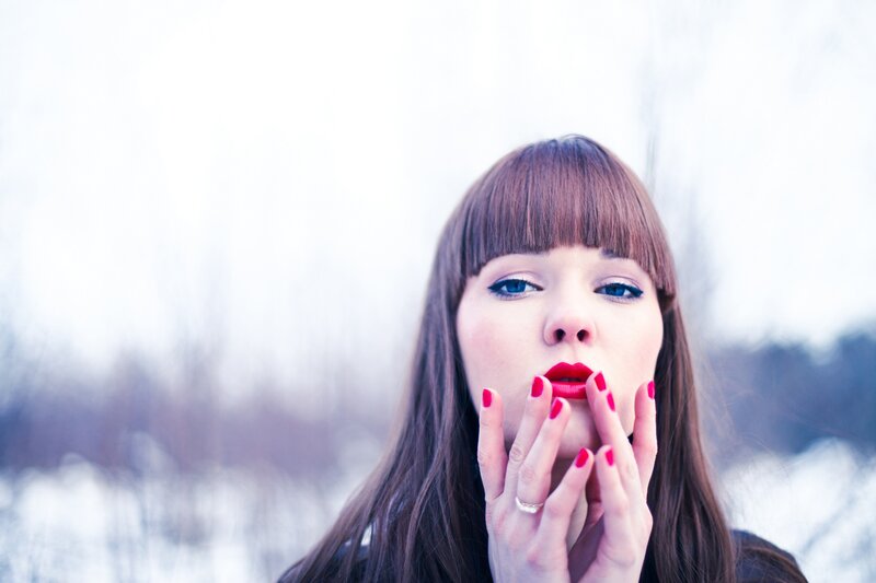 woman with red lipstick outdoors