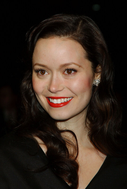 woman with red lipstick smiling