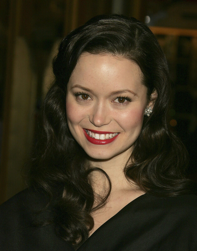 woman with red lipstick smiling