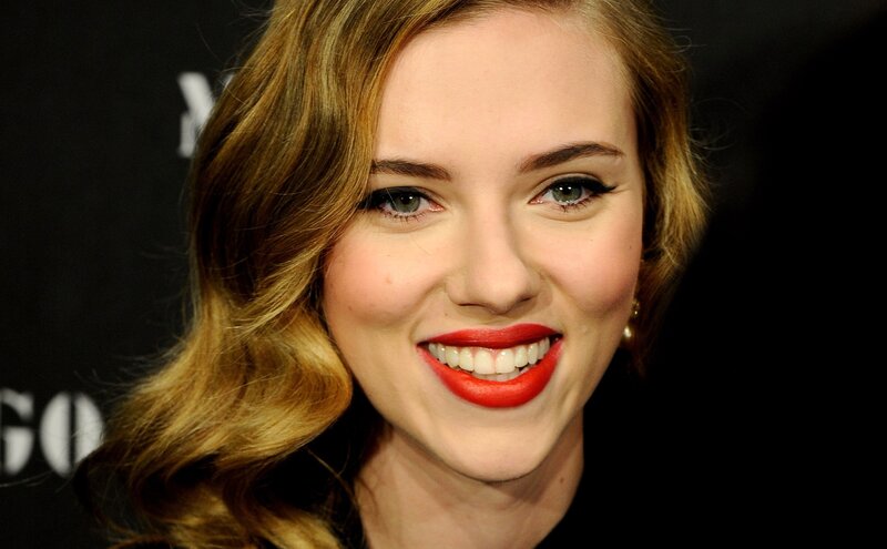 woman with red lipstick smiling