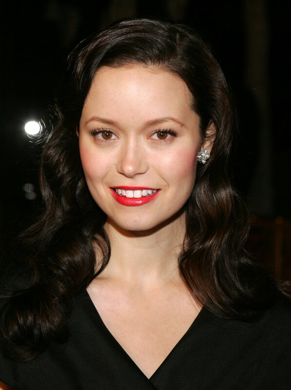 woman with red lipstick smiling