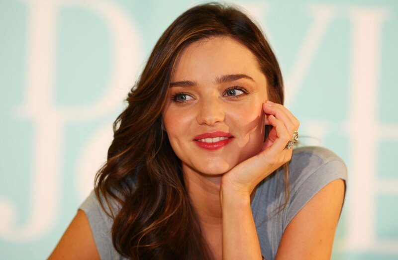 woman with red lipstick smiling