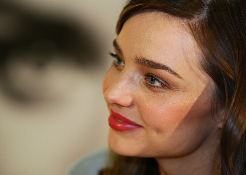 woman with red lipstick smiling