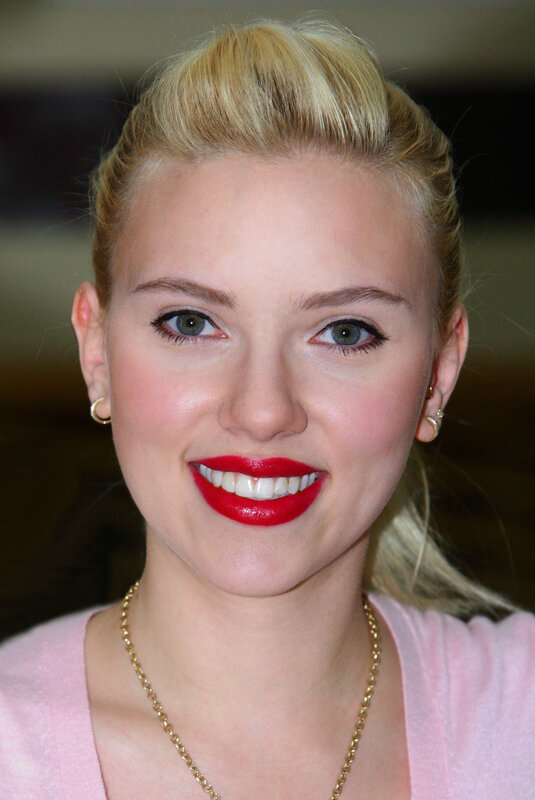 woman with red lipstick smiling