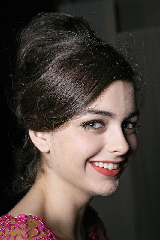 woman with red lipstick smiling