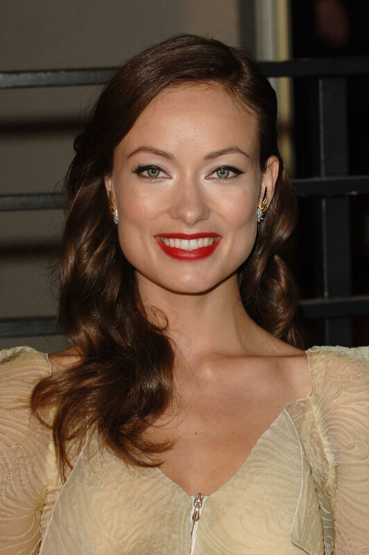 woman with red lipstick smiling