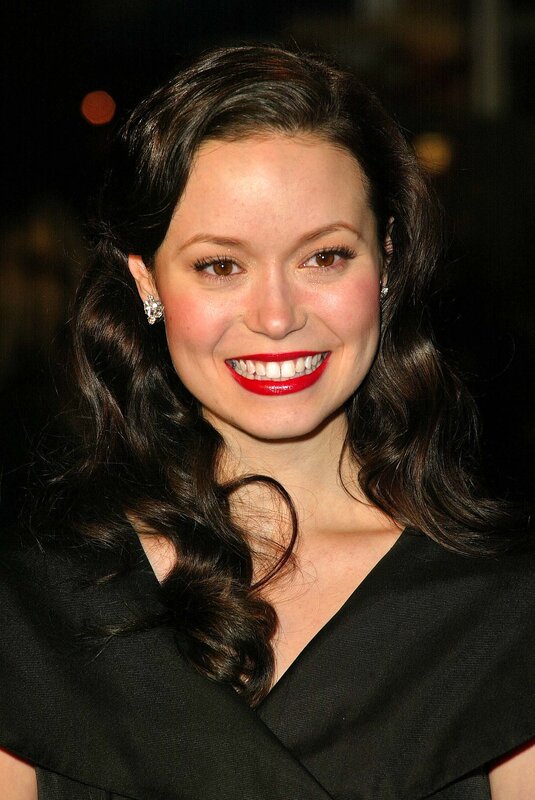 woman with red lipstick smiling