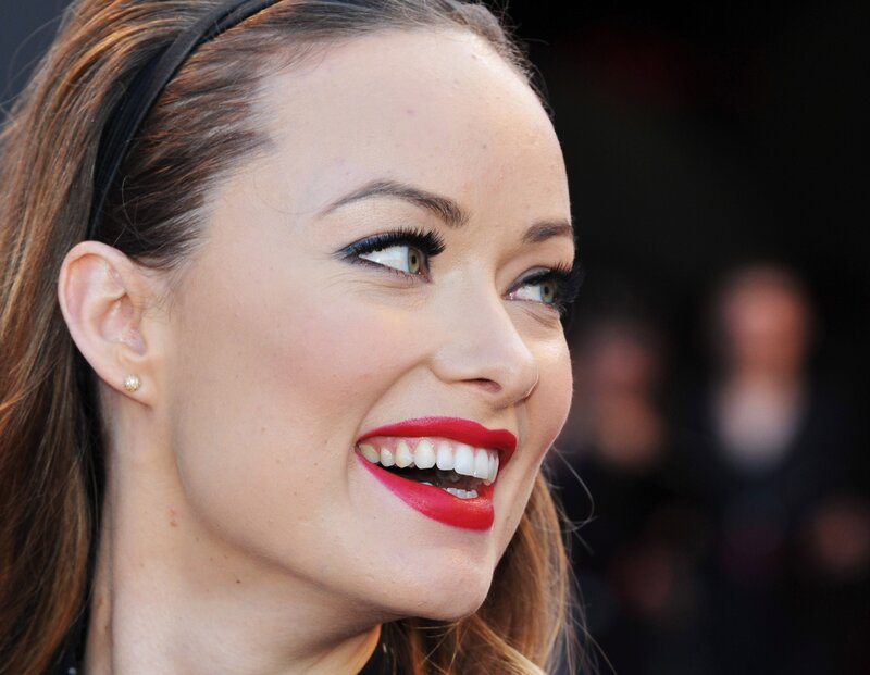 woman with red lipstick smiling