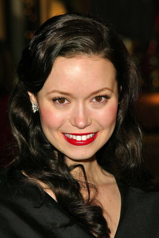 woman with red lipstick smiling