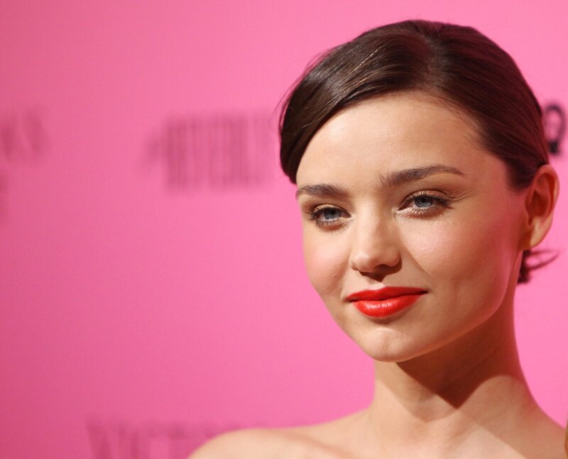 woman with red lipstick smiling