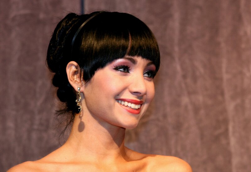 woman with red lipstick smiling