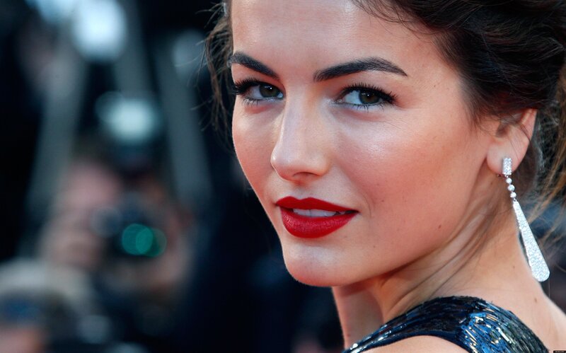 woman with red lipstick smiling