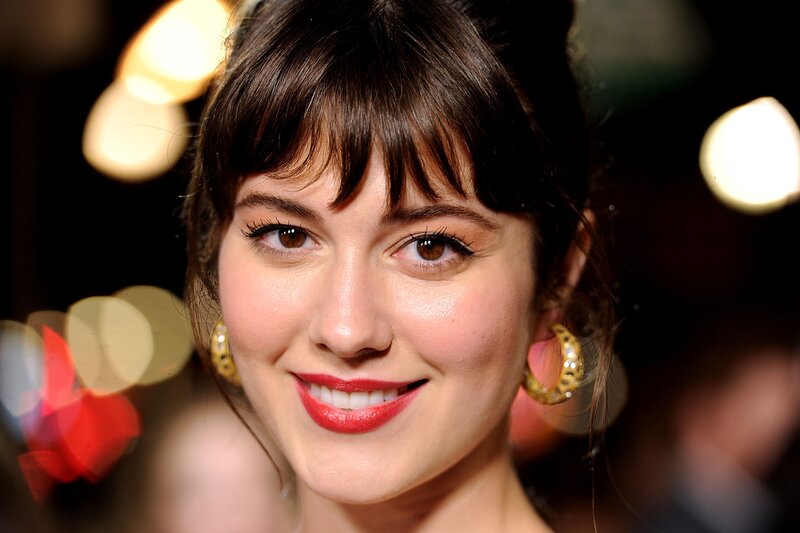 woman with red lipstick smiling