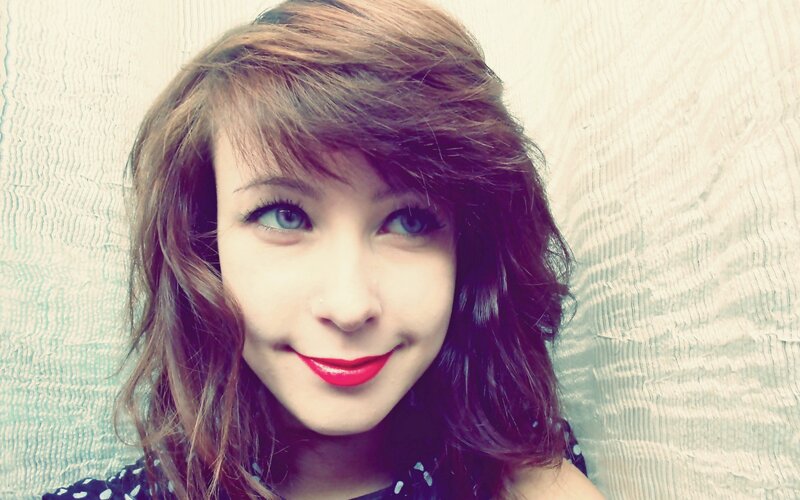 woman with red lipstick smiling