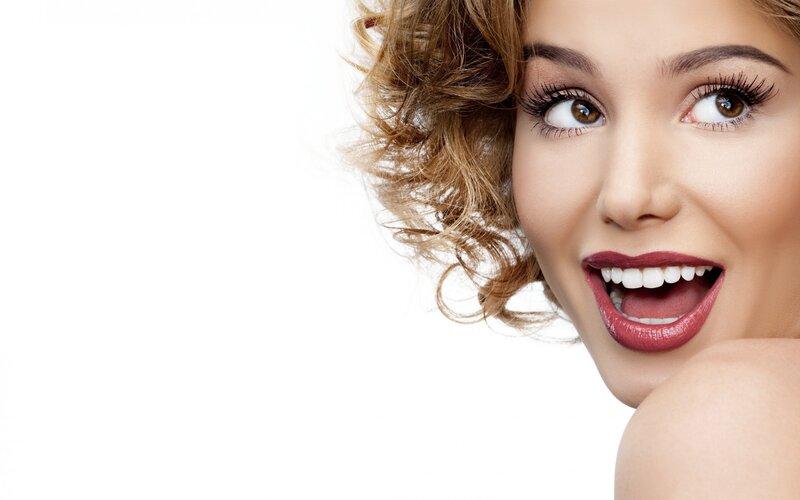 woman with red lipstick smiling