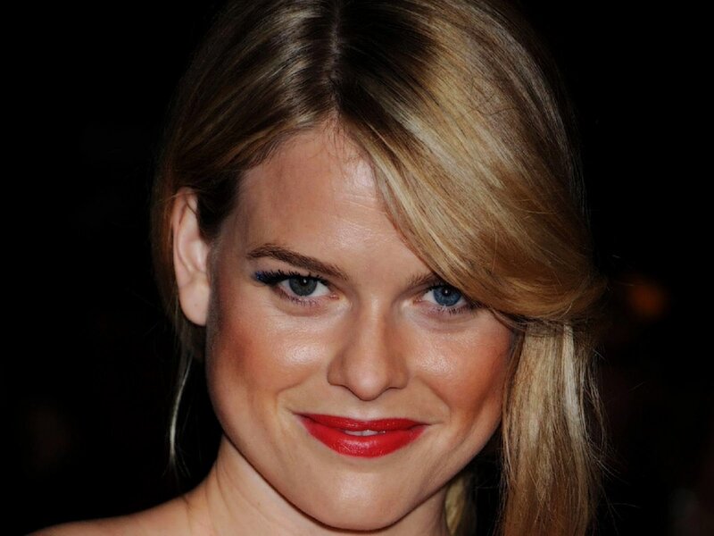 woman with red lipstick smiling